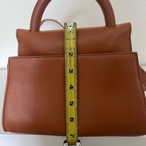 Tan Mini Bag with Gold Accents and Structured Design